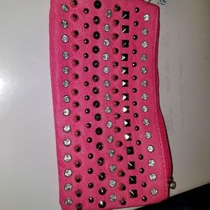 Fuchsia colored cosmetic bag